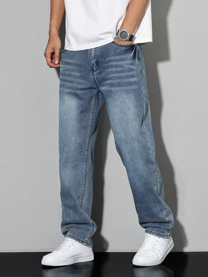 Side profile of men's casual loose fit washed denim trousers. Straight leg pants for daily wear.