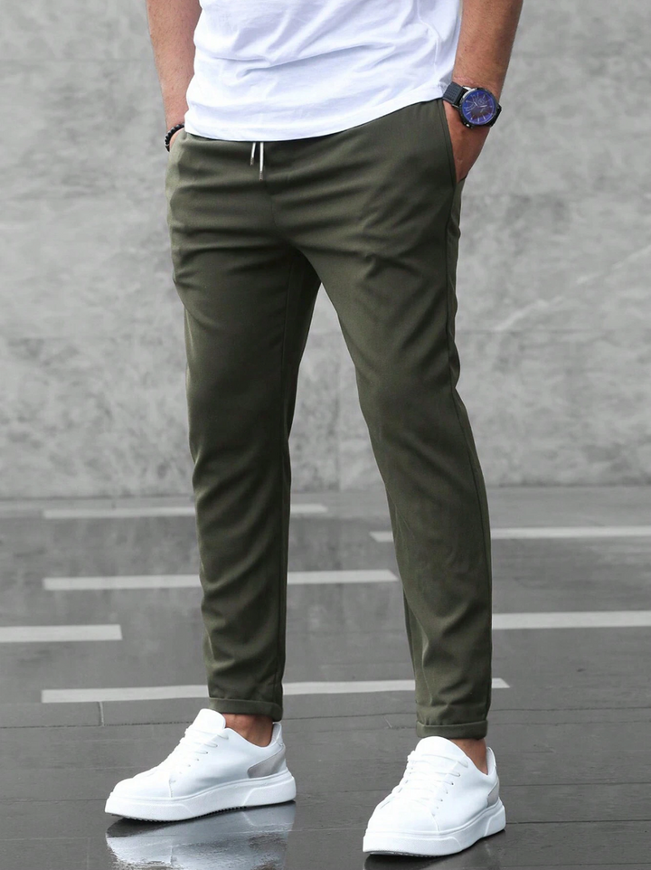 Man in modern tailored stretch pants, demonstrating comfort and business casual elegance.