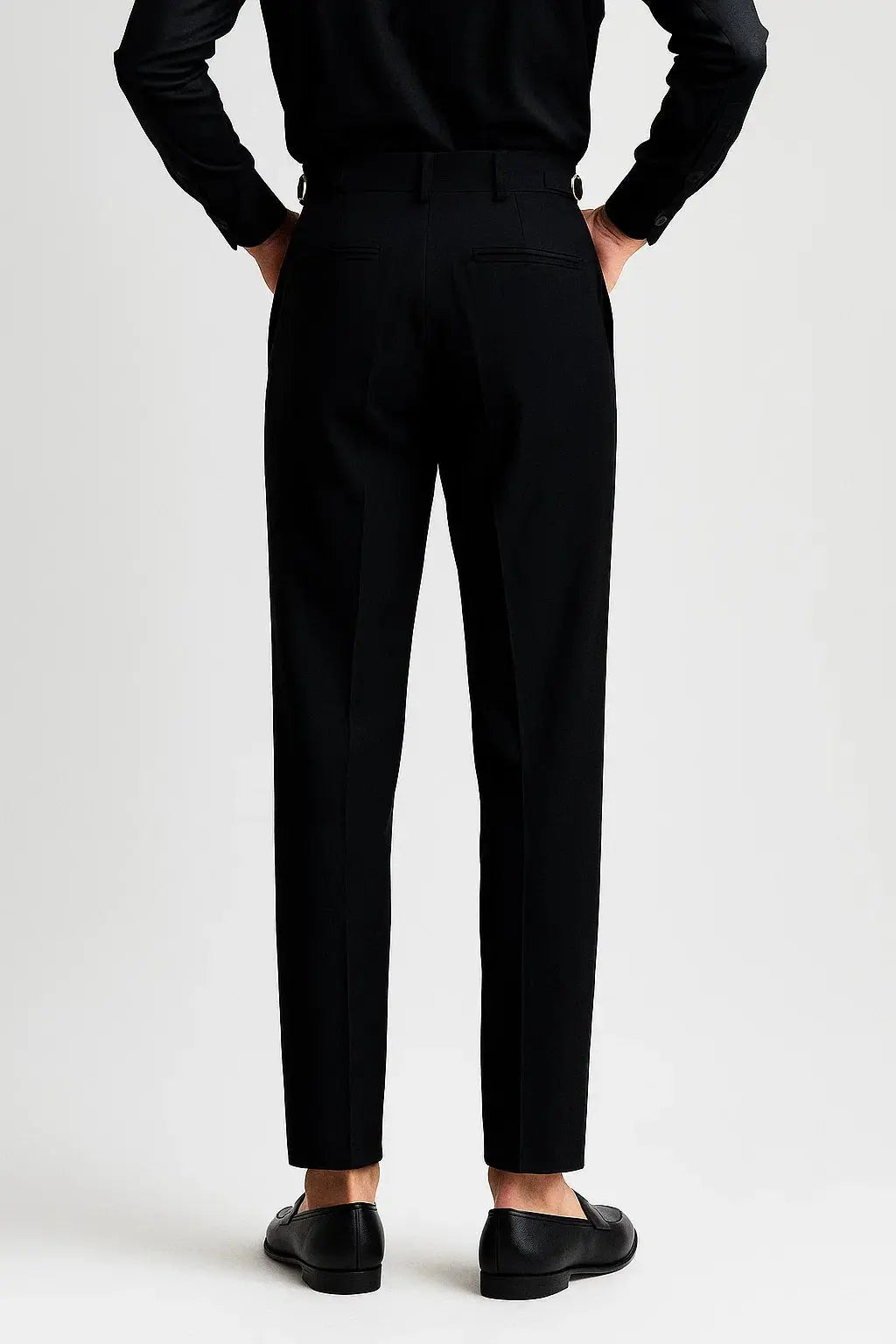 Men's elegant modern fit trousers with a stylish rolled hem and classic pleated design for fashion.