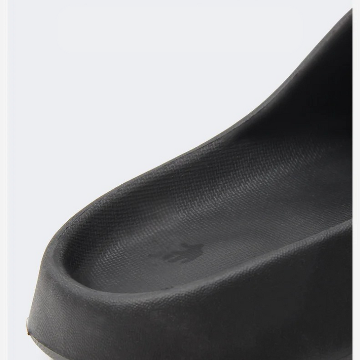 Stylish men's casual slip-on slippers with modern design, offering comfort for home & outdoor use.