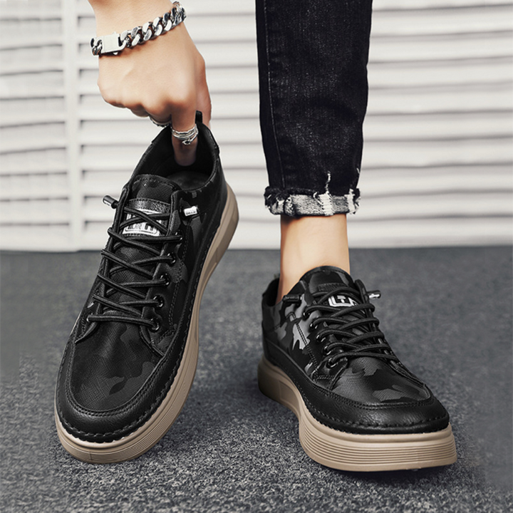 Sleek side view of men's modern casual sneakers. Comfortable, durable athletic footwear for everyday wear.