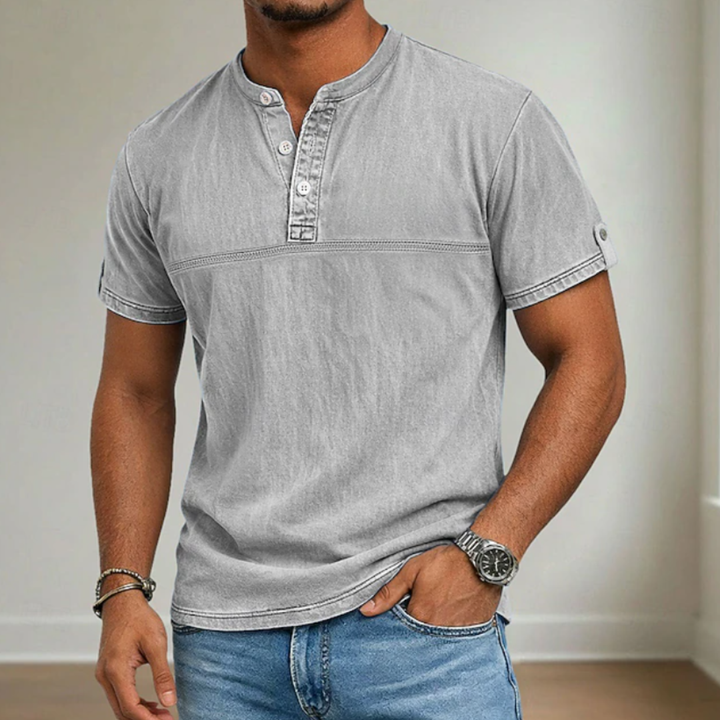 Man wearing a modern short sleeve stand collar Henley shirt, perfect for a relaxed summer day out.