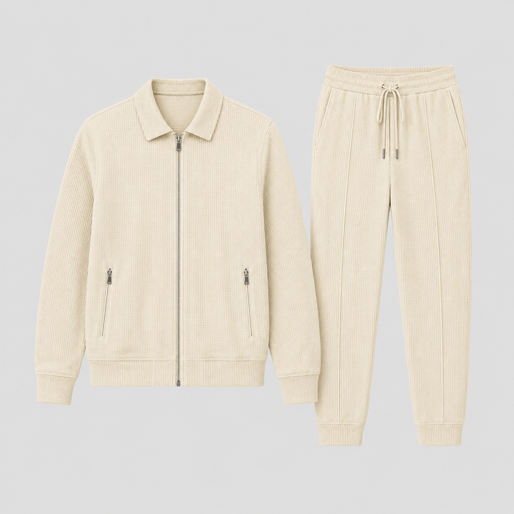 Men's modern tracksuit set in gray, featuring a full-zip jacket & matching track pants for versatile comfort.