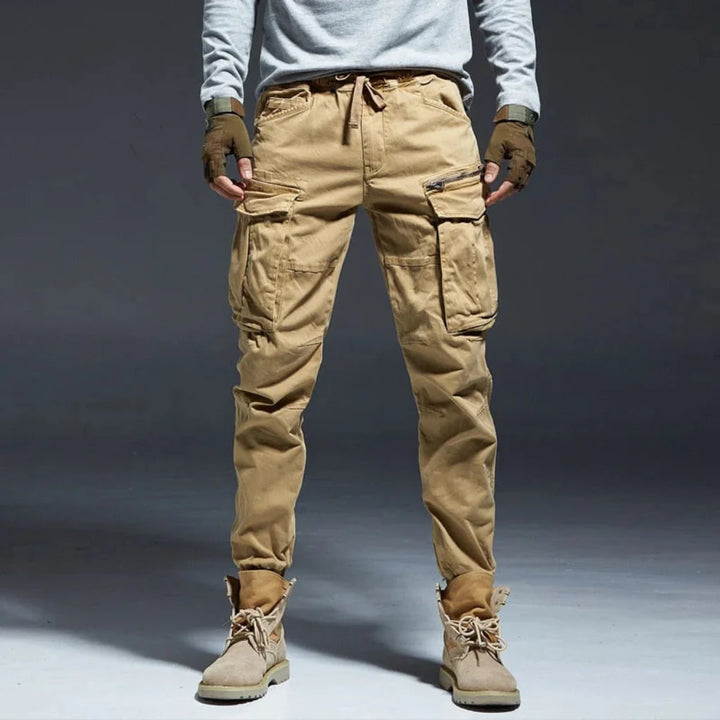 Men's multi-pocket cargo pants, relaxed fit, ideal for casual wear, outdoor activities, & everyday comfort.
