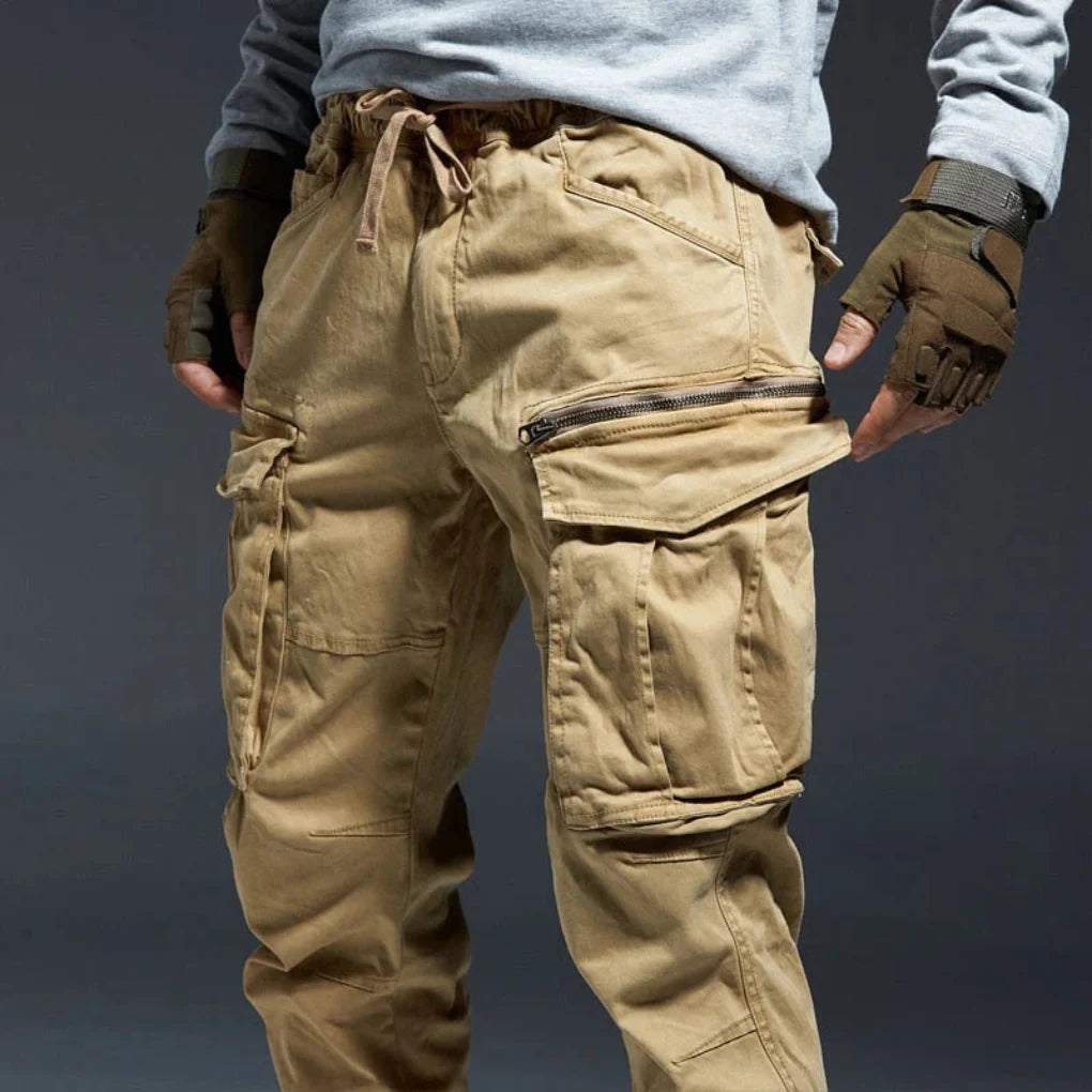 Men's travel cargo pants with elastic waist, multi-pockets, offering ultimate comfort & functionality.
