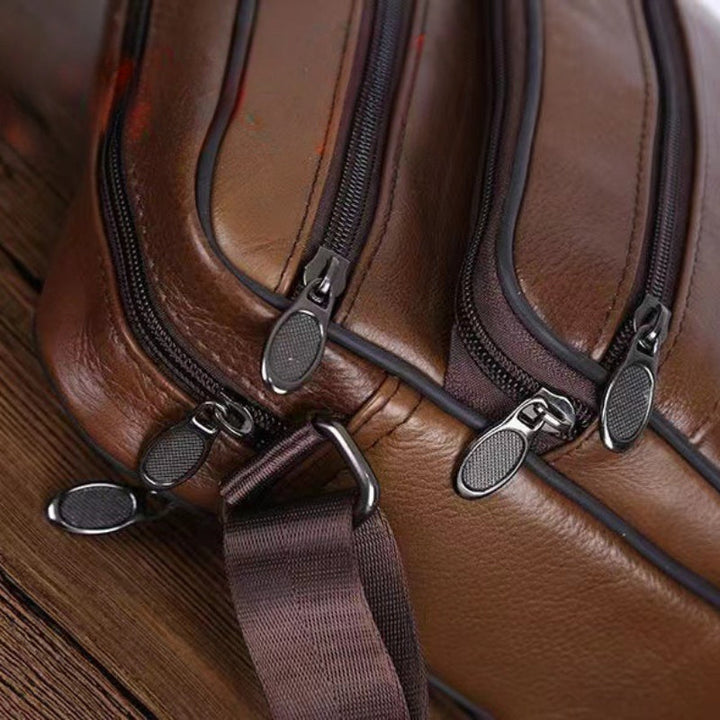 Sleek black textured men's crossbody bag, featuring multiple secure pockets for modern style.