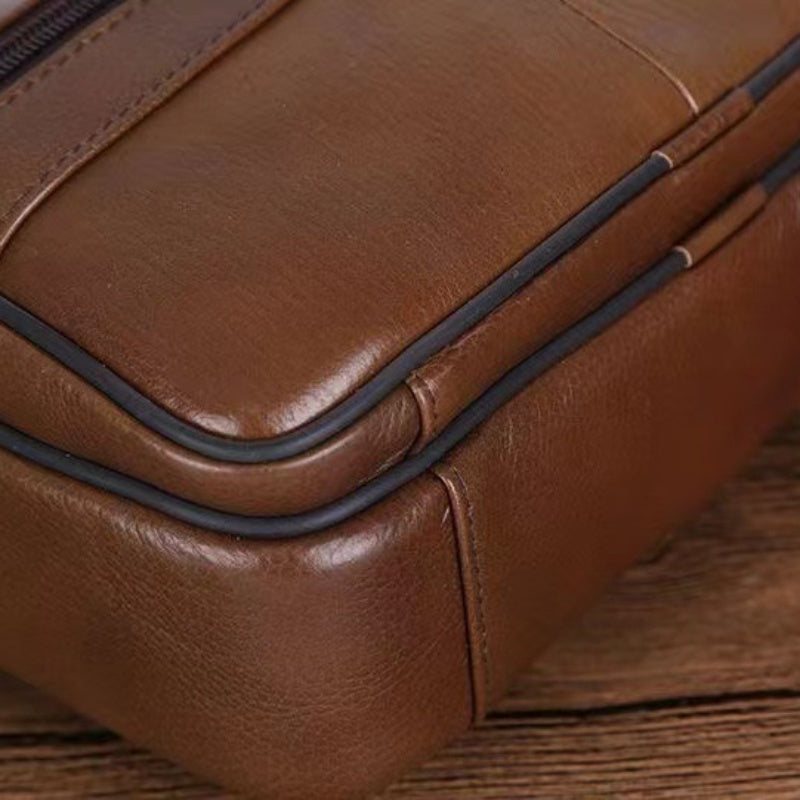 Rich brown textured men's multi-pocket crossbody bag, durable synthetic leather for everyday use.