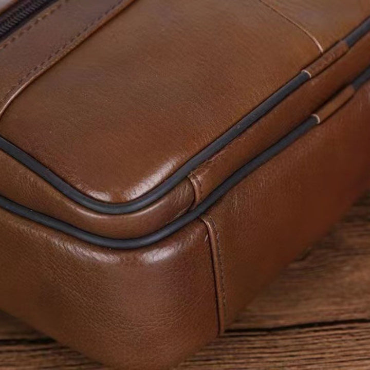 Rich brown textured men's multi-pocket crossbody bag, durable synthetic leather for everyday use.