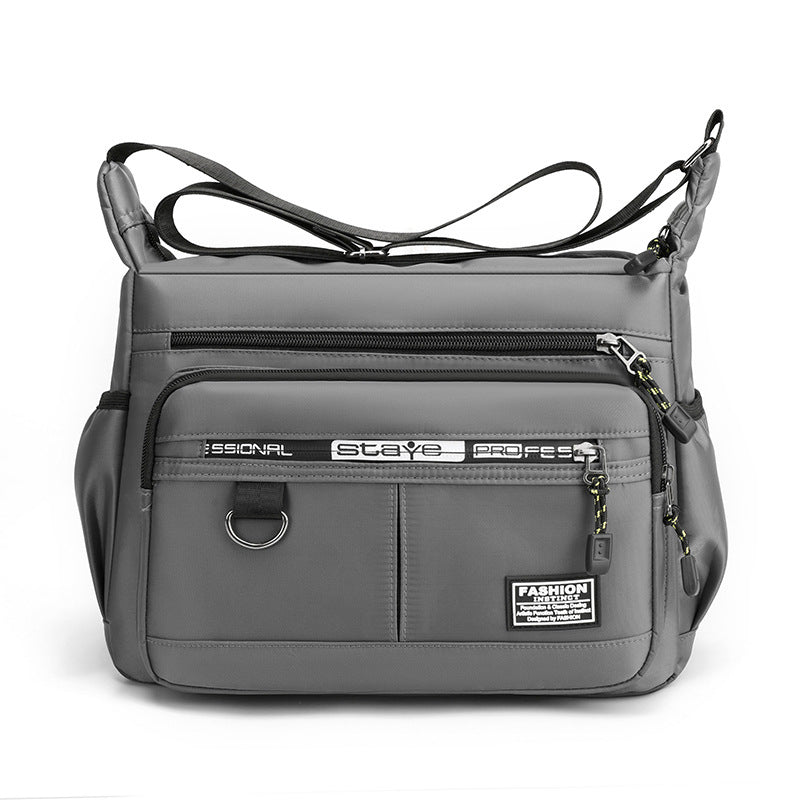 Interior view of men's multi-pocket crossbody messenger bag, showing spacious waterproof compartments.