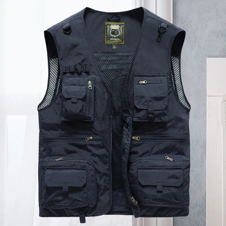 Man fly fishing in a lightweight multi-pocket outdoor vest, suitable for various activities.