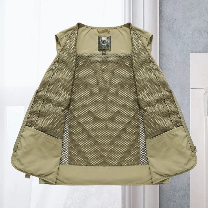 Durable men's outdoor gilet, lightweight for hiking & camping, many utility pockets.