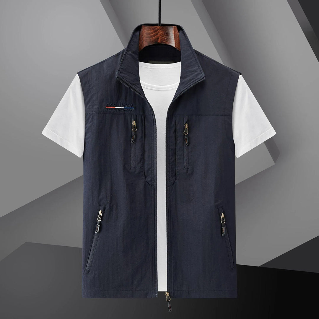 Men's multi-pocket utility vest for travel & outdoor activities. Breathable, sleeveless design, perfect for hiking or fishing.