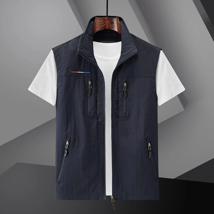 Men's multi-pocket utility vest for travel & outdoor activities. Breathable, sleeveless design, perfect for hiking or fishing.
