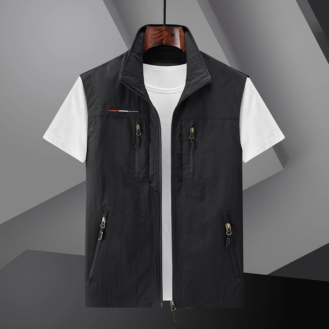 Lightweight men's utility vest with multiple pockets, ideal for fishing, hiking, and summer travel. Breathable outdoor gear.