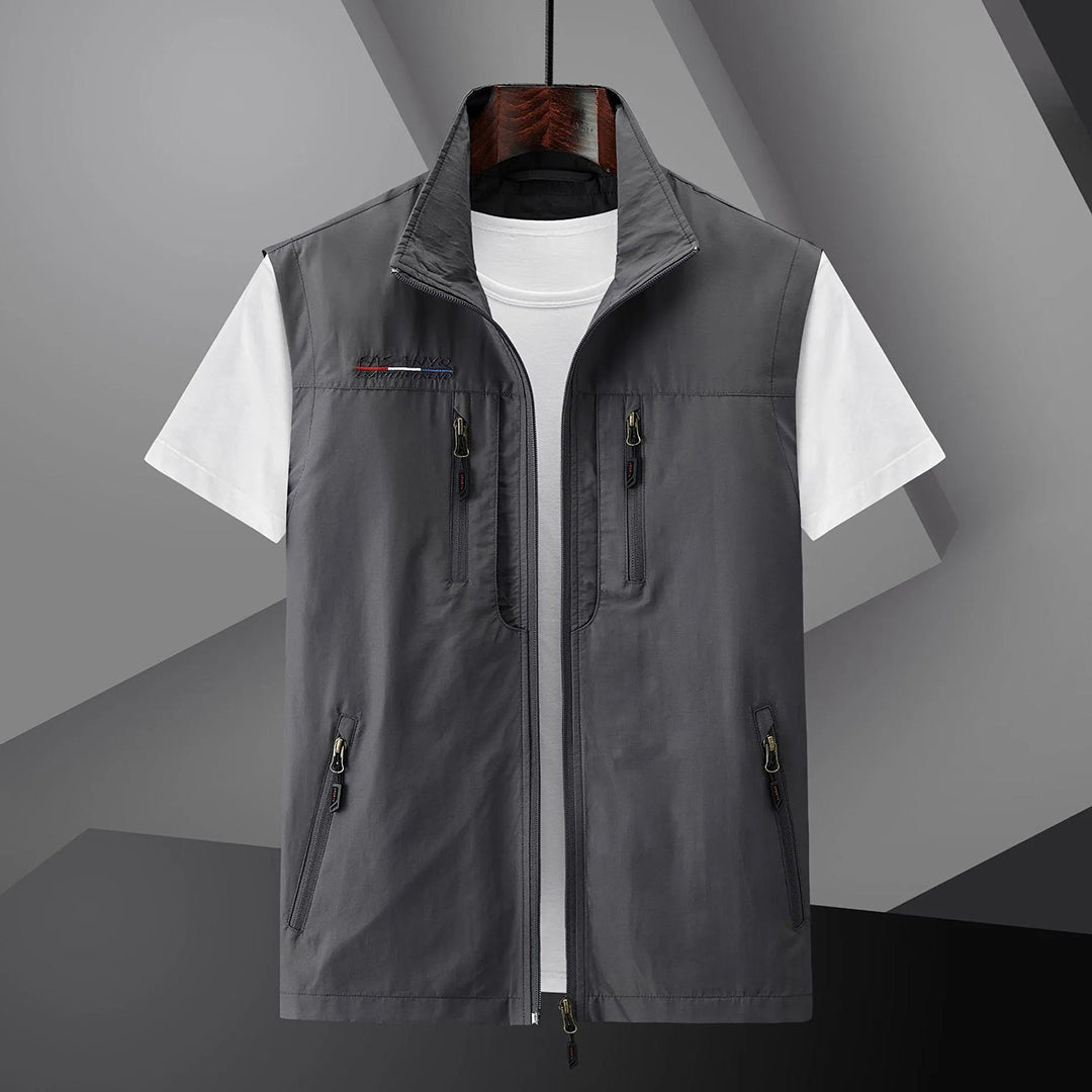Versatile men's travel vest with many pockets for essentials. Breathable and sleeveless, great for outdoor adventures or fishing.
