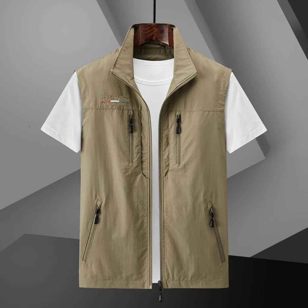 New men's multi-pocket utility vest. Durable & breathable outdoor gear, ideal as a fishing or hiking vest for summer travel.