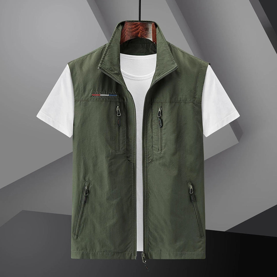 Sleeveless men's utility vest, multi-pocket design for outdoor gear, travel, fishing, or hiking. Breathable & practical.
