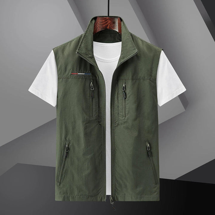 Sleeveless men's utility vest, multi-pocket design for outdoor gear, travel, fishing, or hiking. Breathable & practical.
