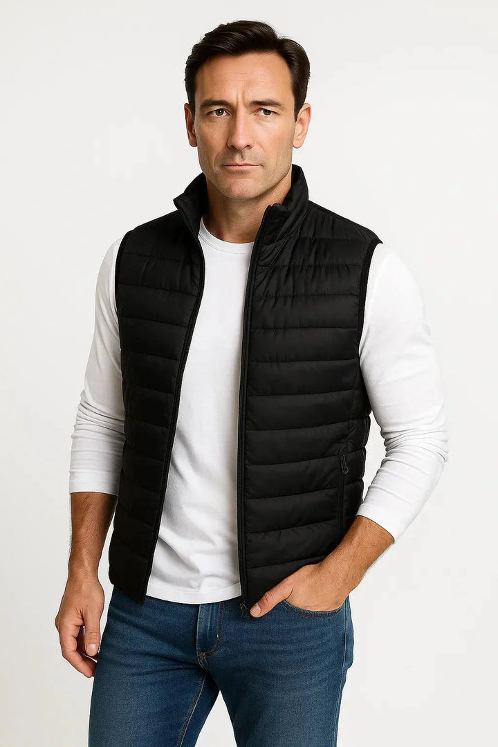 Durable men's black sleeveless puffer vest with high stand collar for winter outdoor wear.