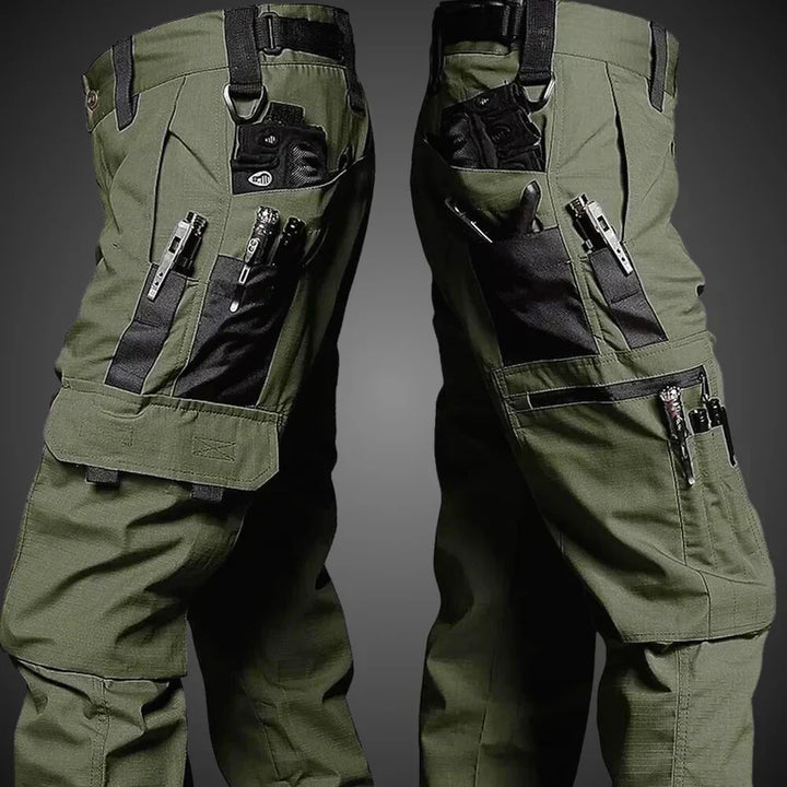 Men's Nikolai tactical cargo pants in olive green, durable & versatile with multiple utility pockets for outdoor adventures.
