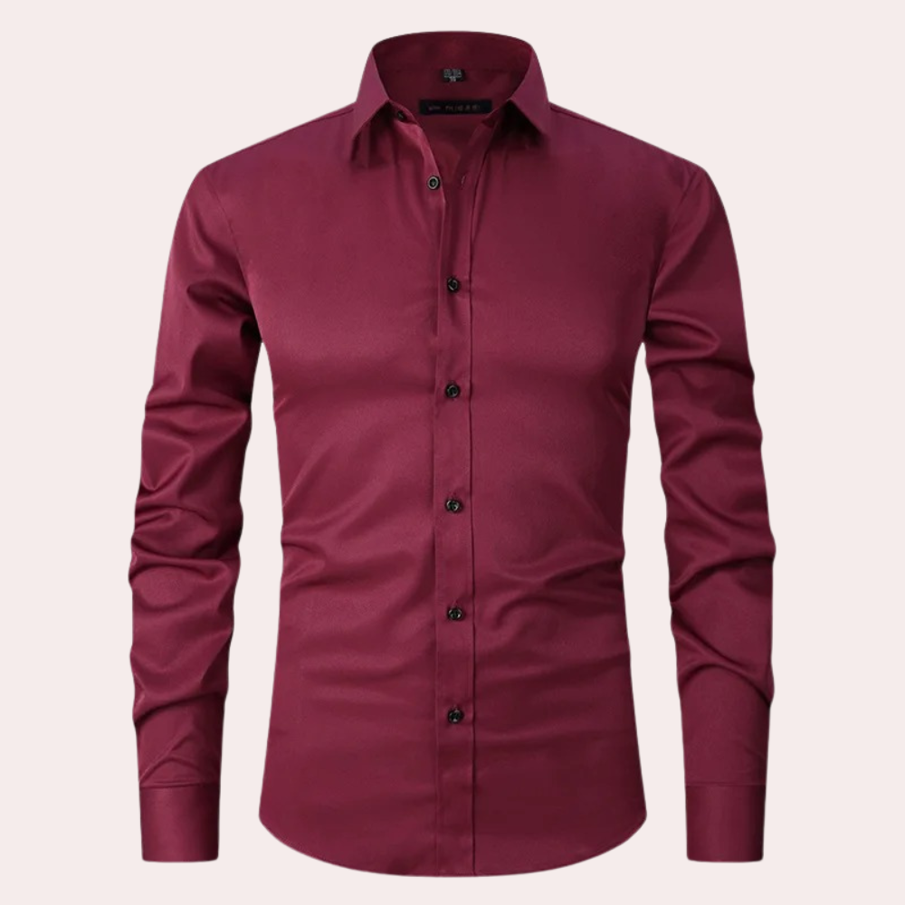 Stylish men's button-down long sleeve dress shirt. Non-iron stretch fabric ensures a sleek, comfortable slim fit.