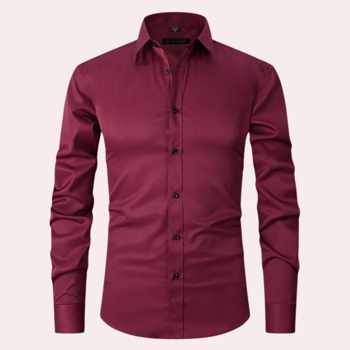 Stylish men's button-down long sleeve dress shirt. Non-iron stretch fabric ensures a sleek, comfortable slim fit.