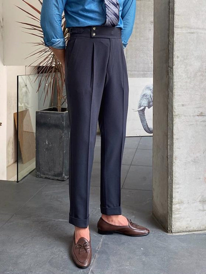 Khaki men's Gurkha trousers, tailored and pleated, embodying old money classic style.