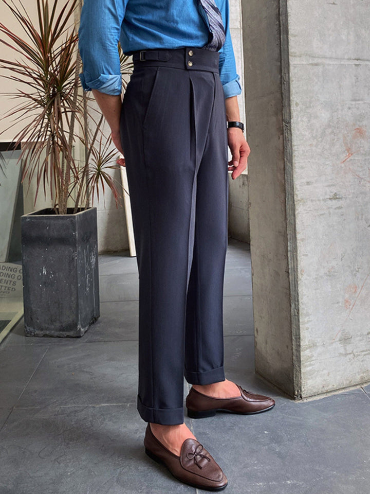 Close-up of the double buckle closure on men's Gurkha pants, highlighting timeless tailored details.