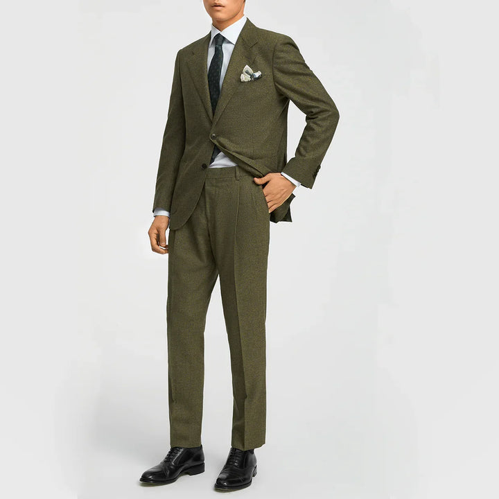 Stylish gentleman in a sharp olive green three-piece suit. Perfect business attire & formal event outfit.