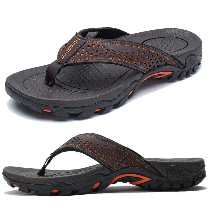 Textured sole men's flip-flops for outdoor grip and cushioned comfort. Ideal for summer travel.