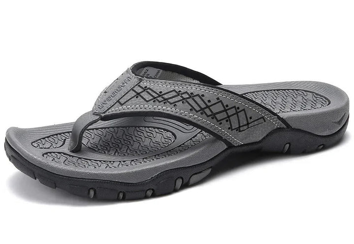 Side view: Men's outdoor sandals with thick cushioning and textured details. Comfortable summer wear.