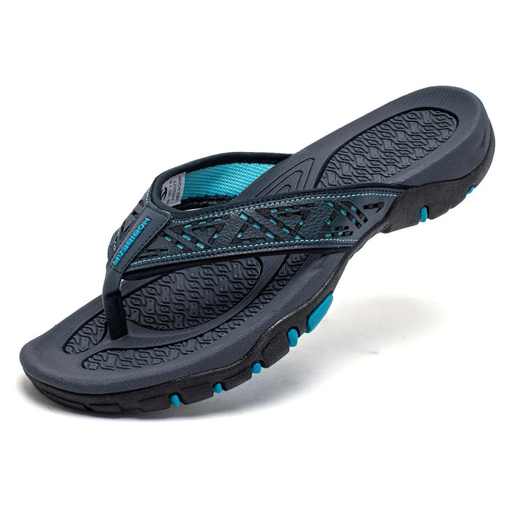 Close-up of textured strap on men's summer flip-flops, cushioned for all-day casual wear.