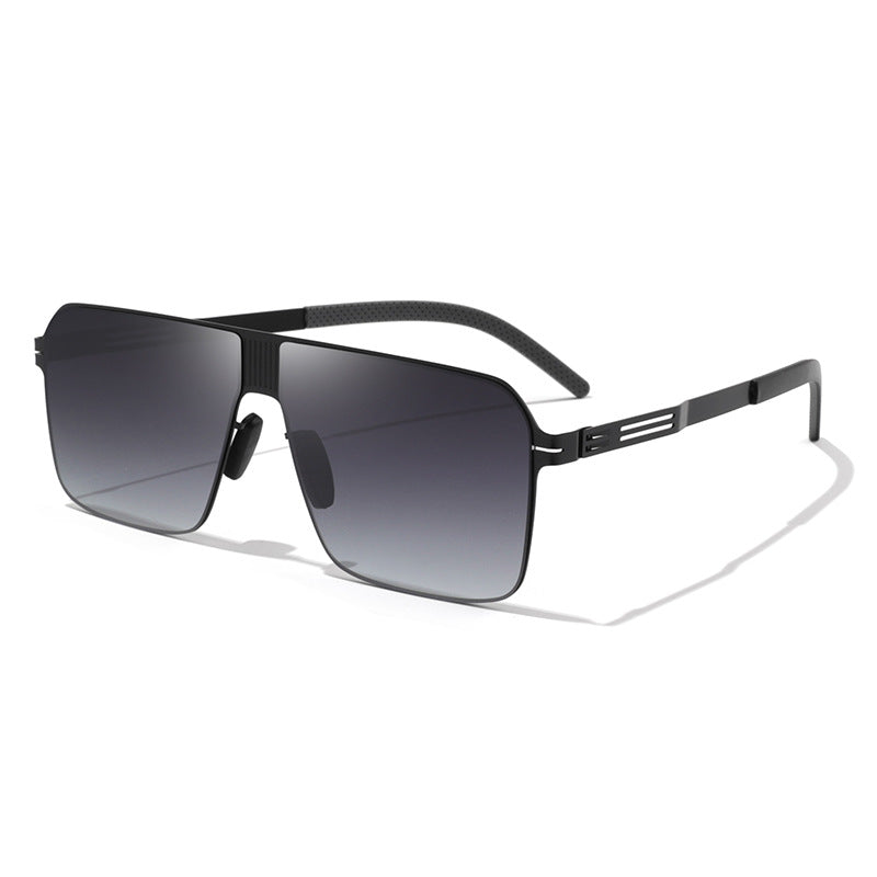 Close-up of men's oversized fashion shield sunglasses, showcasing unique design and eyewear quality.