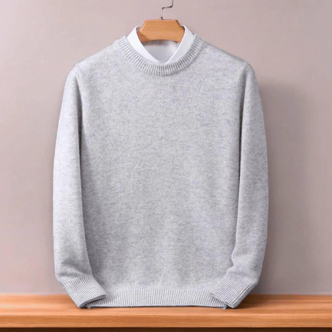 Solid color men's oversized O-neck pullover sweater with a relaxed fit, great for cozy men's apparel.