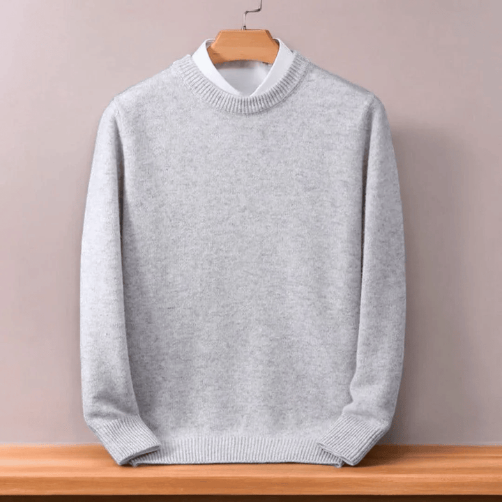Solid color men's oversized O-neck pullover sweater with a relaxed fit, great for cozy men's apparel.