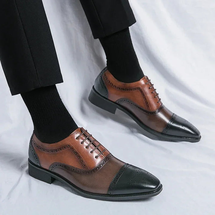 Elegant men's lace-up cap toe dress shoes with sophisticated perforations, perfect for formalwear.