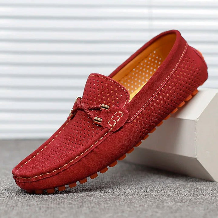Detailed shot of men's perforated slip-on loafers texture, highlighting breathability and quality.