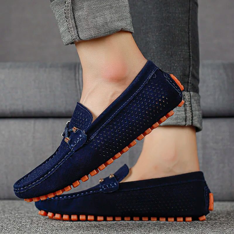 Navy men's perforated slip-on loafers. Stylish and breathable casual shoes for summer and everyday comfort.