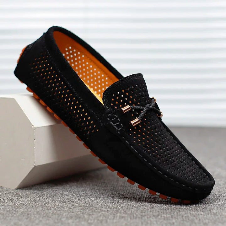Black men's perforated slip-on loafers. Versatile, comfortable, and breathable smart casual shoes for men.