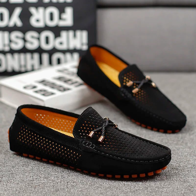 Grey men's lightweight perforated slip-on loafers. Ideal for casual comfort and breathable summer style.