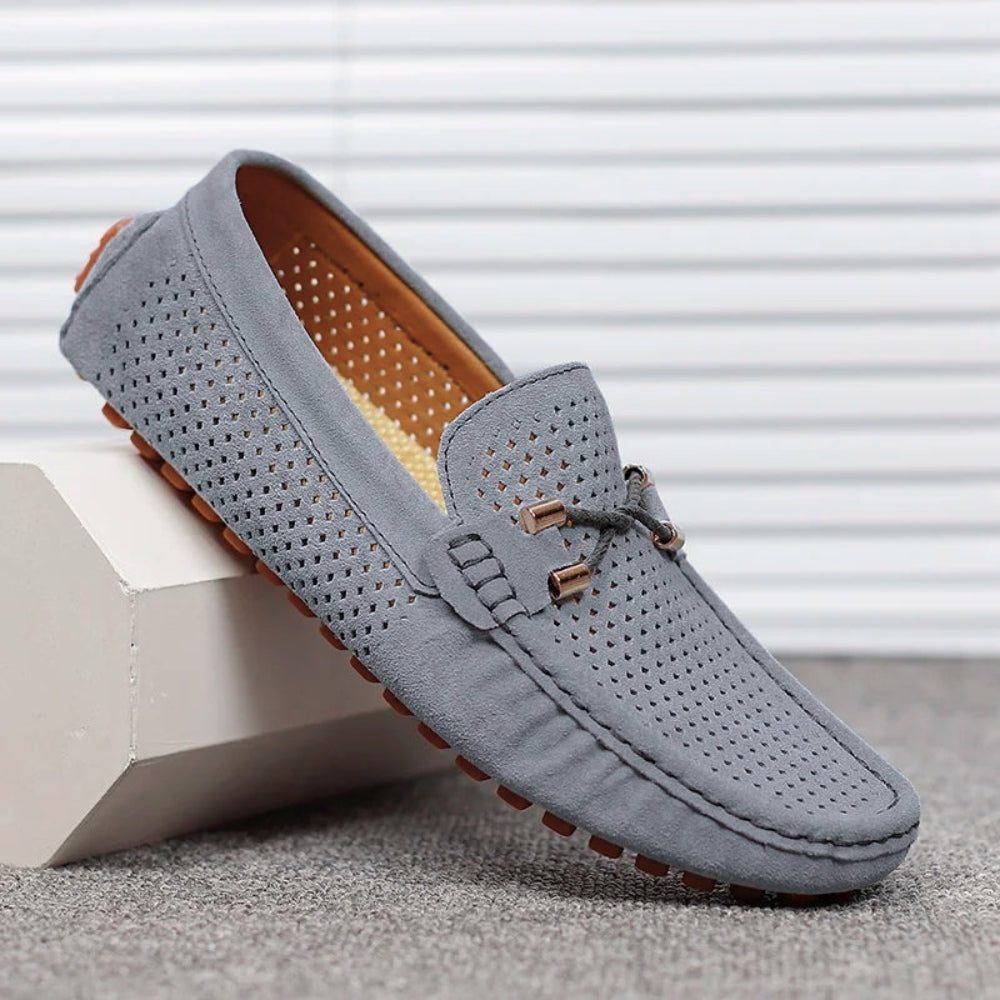 Burgundy men's perforated slip-on loafers, offering smart casual style and breathable comfort.