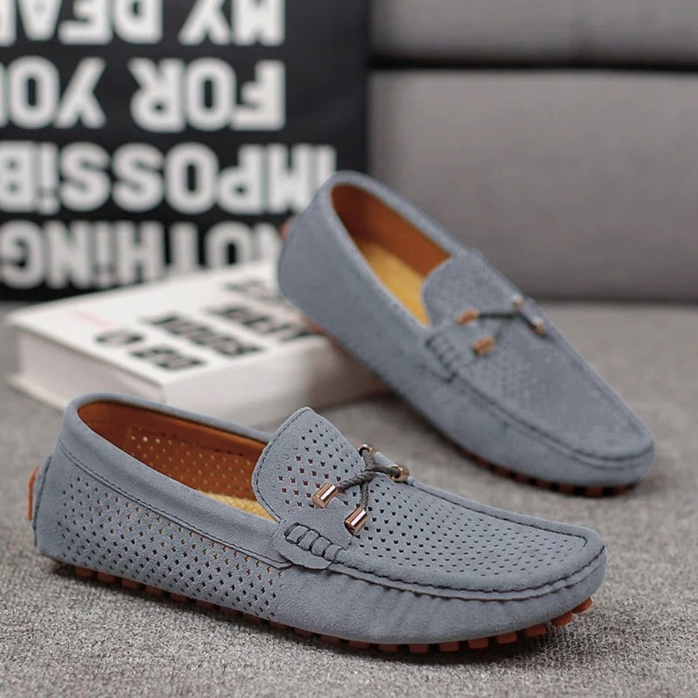 Stylish men's perforated slip-on loafers for everyday wear. Enjoy breathable comfort and smart casual looks.