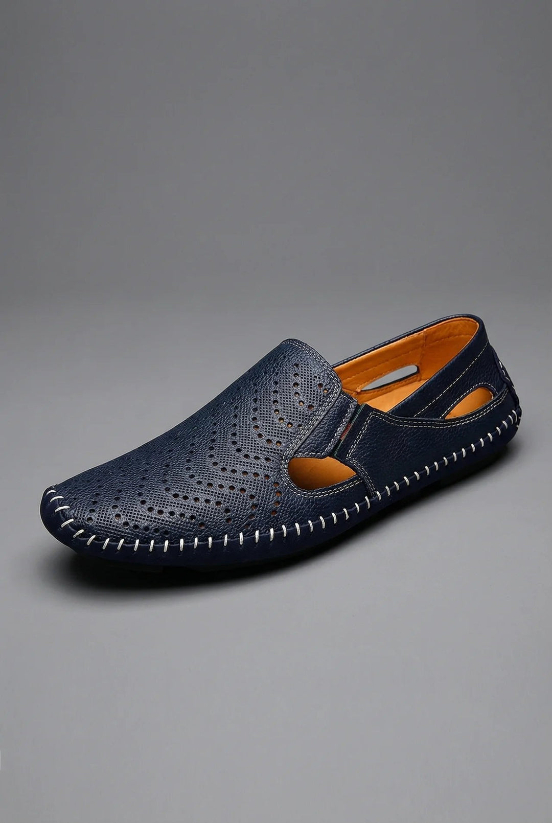 Men's perforated slip-on loafers, perfect for smart-casual summer style & everyday comfort.