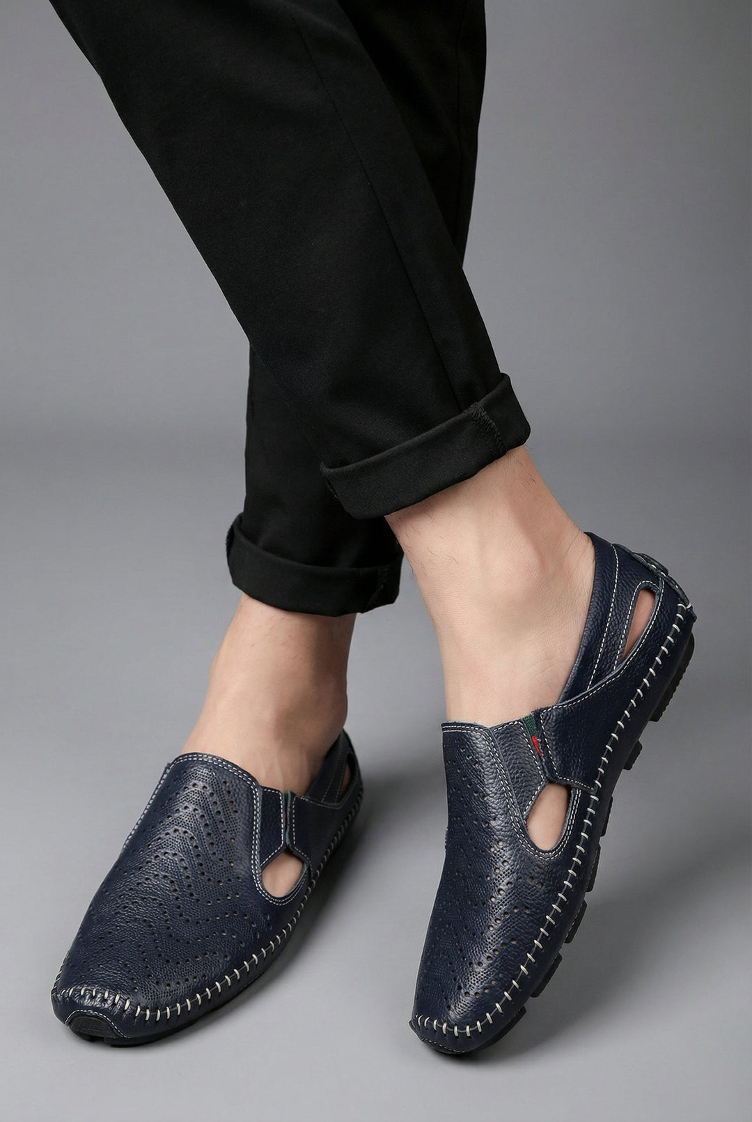 Smart-casual men's slip-on loafers, perforated for breathability, ideal for summer fashion.