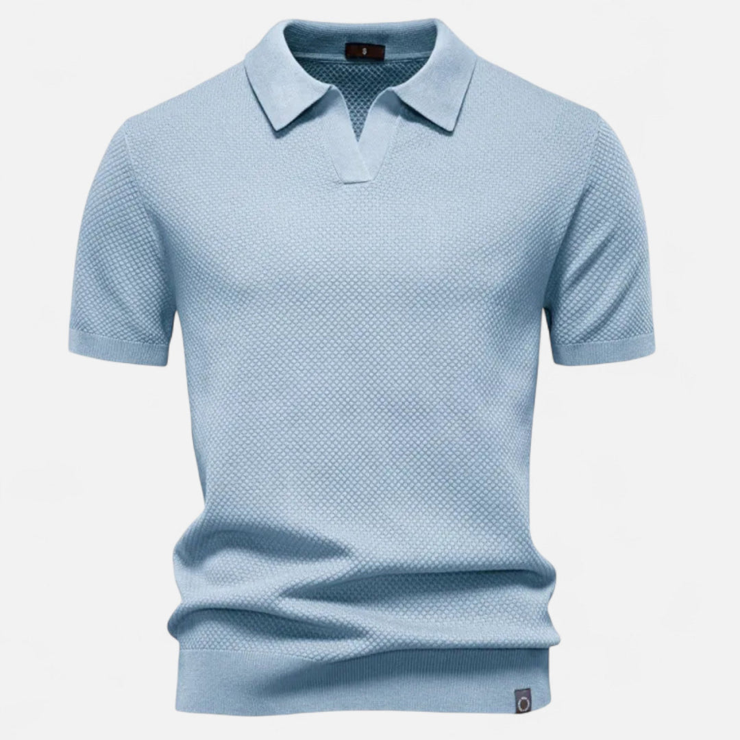 Button placket detail on men's casual pineapple print polo shirt, for a versatile and effortless style.