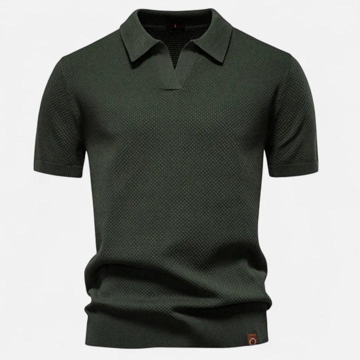 Folded men's short sleeve pineapple print polo shirt, highlighting its vibrant design and soft fabric.