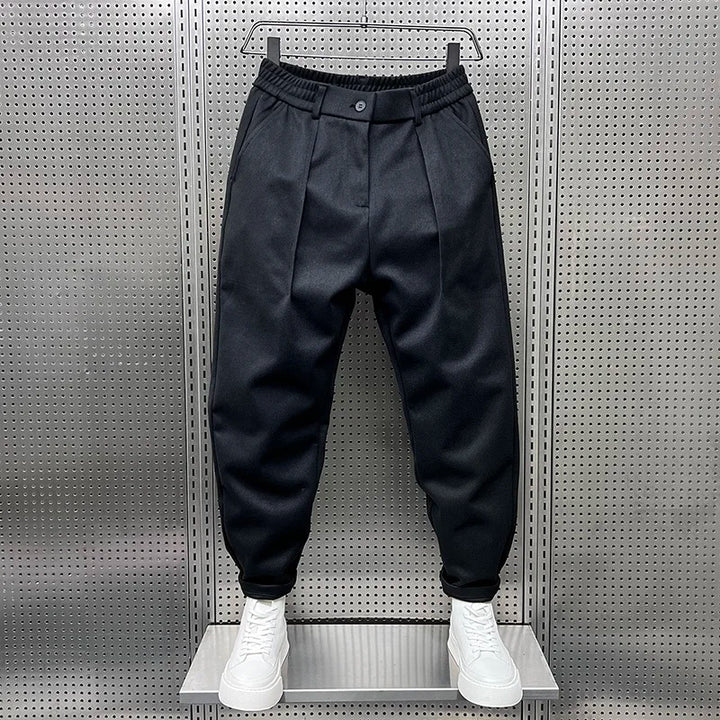 Relaxed fit men's pleated tapered trousers. Comfortable & versatile for everyday and smart casual wear.