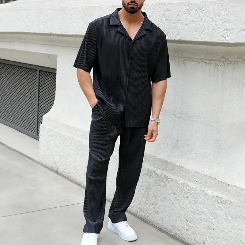 Modern men's pleated short sleeve shirt and straight leg trousers two-piece set. Stylish for casual or smart casual wear.