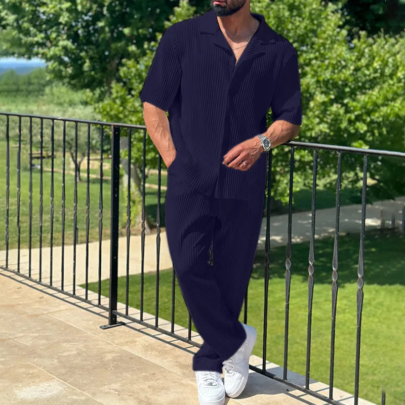 Men's summer pleated outfit: camp collar short sleeve shirt & straight leg trousers. Relaxed yet smart for any occasion.