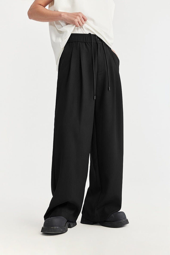Versatile men's wide leg drawstring trousers with pleats. Comfortable for casual & smart casual wear.